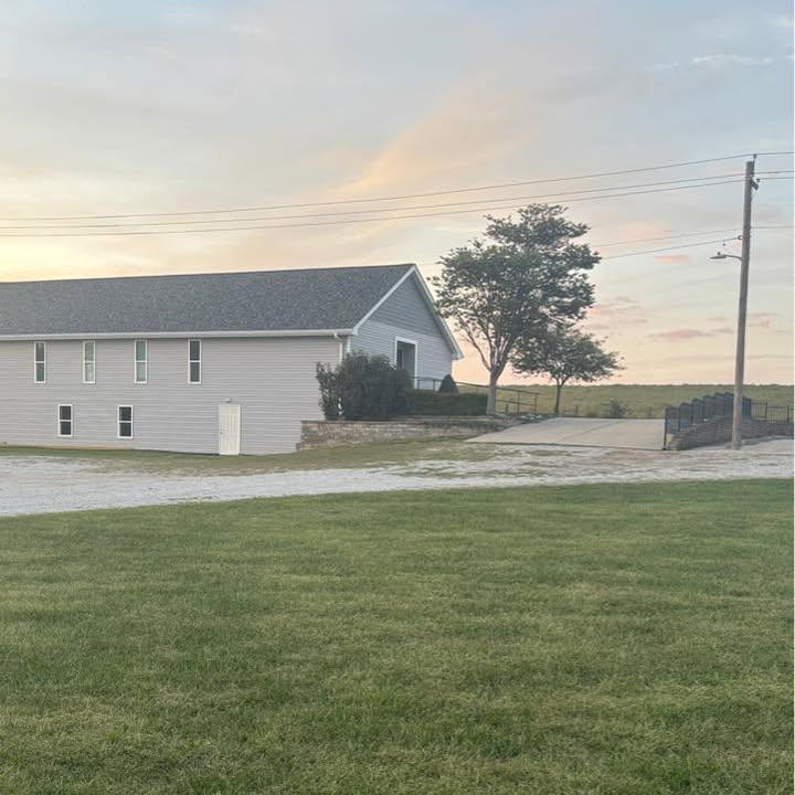The church building and grounds at dusk